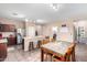 Bright kitchen features stainless steel appliances, kitchen island, and an adjacent dining area at 20784 N Marina Ave, Maricopa, AZ 85139