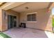 Covered patio area with bench seating, offering a comfortable outdoor space for relaxation or entertaining at 20784 N Marina Ave, Maricopa, AZ 85139