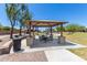 Community picnic area includes picnic tables and nearby playground for Gathering recreation at 20784 N Marina Ave, Maricopa, AZ 85139