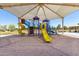 Vibrant playground with multiple slides and climbing structures, offering a delightful play area for children at 20784 N Marina Ave, Maricopa, AZ 85139