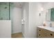 Modern bathroom showcasing a glass-enclosed shower and a stylish vanity with marble countertop at 22619 N La Senda Dr, Scottsdale, AZ 85255