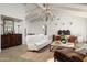 Spacious living room featuring high ceilings, a chandelier, wood floors, and elegant furnishings at 22619 N La Senda Dr, Scottsdale, AZ 85255