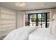 Light, airy bedroom with backyard views and modern wall art at 22619 N La Senda Dr, Scottsdale, AZ 85255