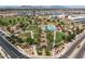 Aerial view of community pool with recreation, lawn area, and lush desert landscaping at 22924 E Desert Spoon Dr, Queen Creek, AZ 85142