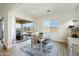 Bright dining room with sliding glass doors and a view of the outdoor space at 22924 E Desert Spoon Dr, Queen Creek, AZ 85142