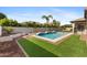 Backyard featuring a pool, and lush lawn at 253 W Malibu Dr, Chandler, AZ 85248