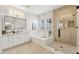 Contemporary bathroom with a separate shower, tub, and vanity offering a spa-like experience at 253 W Malibu Dr, Chandler, AZ 85248