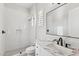 Modern bathroom featuring a glass-enclosed shower and vanity with marble countertop at 253 W Malibu Dr, Chandler, AZ 85248