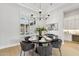 Bright dining room featuring elegant lighting, large windows, and seating for six, perfect for Gathering gatherings at 253 W Malibu Dr, Chandler, AZ 85248