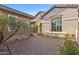 Exterior house shot showing private courtyard, multiple windows and brick accents at 253 W Malibu Dr, Chandler, AZ 85248