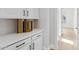 Hallway featuring white cabinets and decor at 253 W Malibu Dr, Chandler, AZ 85248