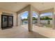 A covered patio shows backyard pool with an outdoor living space featuring neutral decor and direct access to backyard at 253 W Malibu Dr, Chandler, AZ 85248