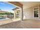 Spacious covered patio with views of the landscaped backyard and inviting pool area, perfect for outdoor entertaining at 253 W Malibu Dr, Chandler, AZ 85248