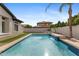 Backyard pool with a waterfall feature and easy access at 253 W Malibu Dr, Chandler, AZ 85248