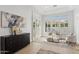 Bright sitting room with plenty of natural light and plantation shutters with designer decorations at 253 W Malibu Dr, Chandler, AZ 85248