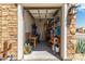 Organized garage with shelving, work table, and neatly stored tools and equipment at 27366 W Escuda Dr, Buckeye, AZ 85396