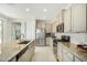 Kitchen featuring an island, granite countertops, and stainless steel appliances at 27366 W Escuda Dr, Buckeye, AZ 85396