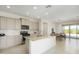 Bright kitchen featuring an island, granite countertops, and stainless steel appliances at 27366 W Escuda Dr, Buckeye, AZ 85396