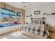 Tranquil bedroom features a window seat, neutral tones, and ample natural light for relaxation and rest at 3095 E Cardinal Ct, Chandler, AZ 85286