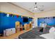 Another view of the bonus room featuring comfy seating, TV, and plenty of baseball decor at 3095 E Cardinal Ct, Chandler, AZ 85286