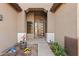 Inviting front entrance with a modern door, potted plants, and well-maintained landscaping at 3095 E Cardinal Ct, Chandler, AZ 85286