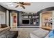 Comfortable living room with custom shelving, built-in media center, and a stylish, neutral color palette at 3095 E Cardinal Ct, Chandler, AZ 85286