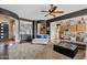 Open-concept living room featuring a cozy seating area and seamless flow into the adjacent kitchen at 3095 E Cardinal Ct, Chandler, AZ 85286