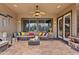 Relaxing covered patio with comfortable seating, ceiling fan, and decorative accents at 3095 E Cardinal Ct, Chandler, AZ 85286