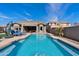 Gorgeous swimming pool with crystal-clear water, a seating area, and manicured landscaping at 3095 E Cardinal Ct, Chandler, AZ 85286