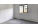 Modest bedroom with carpet, a window, and white walls at 35378 W Santa Barbara Ave, Maricopa, AZ 85138