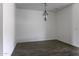 The Dining Room has grey wood-look flooring with a pendant light fixture at 35378 W Santa Barbara Ave, Maricopa, AZ 85138