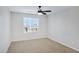 Empty bedroom featuring neutral walls, carpeted floor, and a ceiling fan at 38179 W La Paz St, Maricopa, AZ 85138