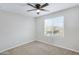 Empty bedroom featuring neutral walls, carpeted floor, and a ceiling fan at 38179 W La Paz St, Maricopa, AZ 85138