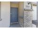 Close-up of the front door with a visible house number and brick-accented columns at 38179 W La Paz St, Maricopa, AZ 85138