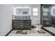 Modern bathroom featuring a double sink vanity, decorative stone backsplash, and separate glass-enclosed shower at 3915 E Hillery Dr, Phoenix, AZ 85032