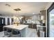 Bright and airy kitchen featuring a spacious marble island, stainless steel refrigerator, and modern finishes at 3915 E Hillery Dr, Phoenix, AZ 85032