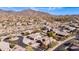 Beautiful aerial shot showcasing a vibrant neighborhood, desert landscaping, and mountain views at 4109 N Twilight Cir, Mesa, AZ 85207