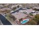 An aerial view of this beautiful property and backyard featuring a private pool, putting green, and desert landscaping at 4109 N Twilight Cir, Mesa, AZ 85207