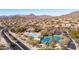 Panoramic aerial view of a community featuring homes, pool, tennis courts, and natural desert landscape at 4109 N Twilight Cir, Mesa, AZ 85207