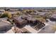 Beautiful aerial shot showcasing single Gathering home with desert landscaping, tile roof, and a paved driveway at 4109 N Twilight Cir, Mesa, AZ 85207