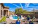 Stunning backyard pool with desert landscaping, complete with a spa and lounging area at 4109 N Twilight Cir, Mesa, AZ 85207