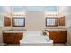 Bathroom with dual sinks, soaking tub and tiled flooring at 4109 N Twilight Cir, Mesa, AZ 85207