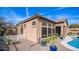 Charming home exterior with desert landscaping, a partial pool view, and a small white fence at 4109 N Twilight Cir, Mesa, AZ 85207