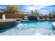 Inviting pool featuring waterfall features and blue tiled accents, creating a relaxing backyard oasis at 4109 N Twilight Cir, Mesa, AZ 85207