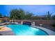 A luxurious pool and spa area with rock waterfall feature is perfect for outdoor relaxation and entertainment at 4109 N Twilight Cir, Mesa, AZ 85207