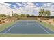 Well-maintained tennis court surrounded by desert landscaping and greenery with a view of Las Sendas at 4109 N Twilight Cir, Mesa, AZ 85207