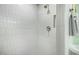 Elegant walk-in shower with white tile and a built-in niche at 4132 N 34Th Pl, Phoenix, AZ 85018