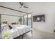 Bedroom showcasing modern furniture, sleek tiled floors, and a calming view of the pool area at 4132 N 34Th Pl, Phoenix, AZ 85018