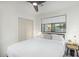 Bright bedroom featuring a modern ceiling fan, window, closet, and stylish bedside table at 4132 N 34Th Pl, Phoenix, AZ 85018