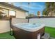 Inviting hot tub with an attractive exterior, steps, and cover in a private backyard setting at 4132 N 34Th Pl, Phoenix, AZ 85018